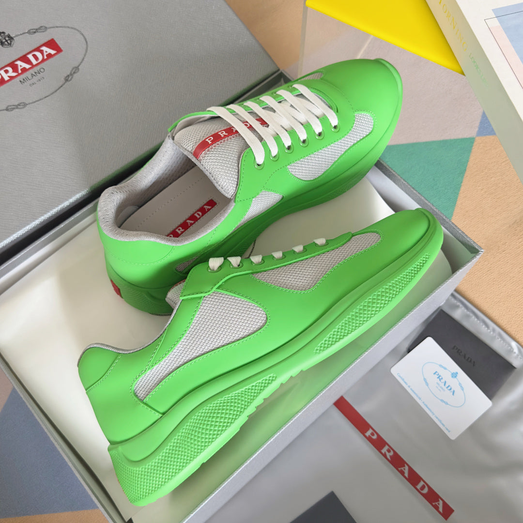 Prada unisex sneakers in neon green with gray mesh panels and white lace detail