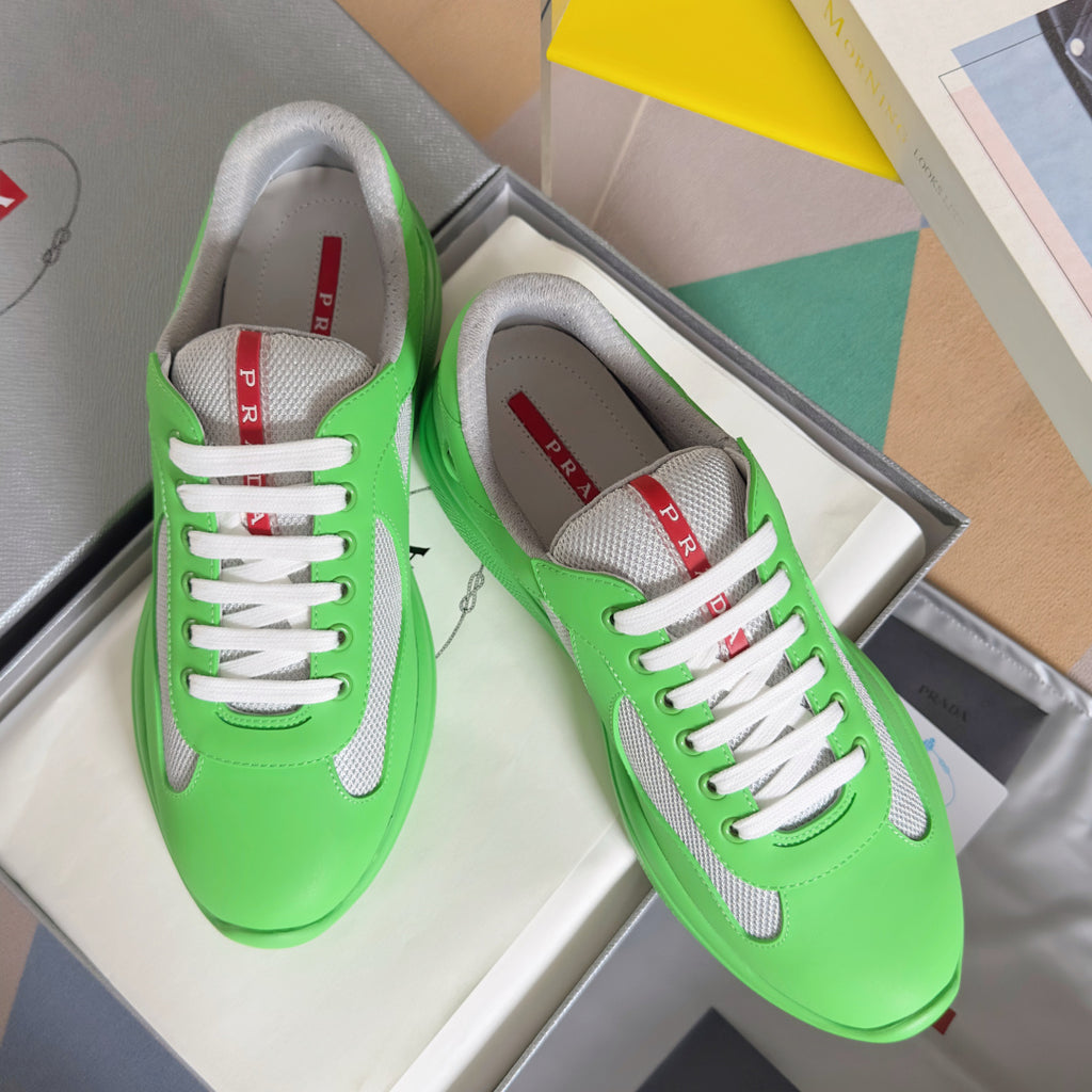 Prada unisex sneakers in neon green with gray suede panels and white lace-up front