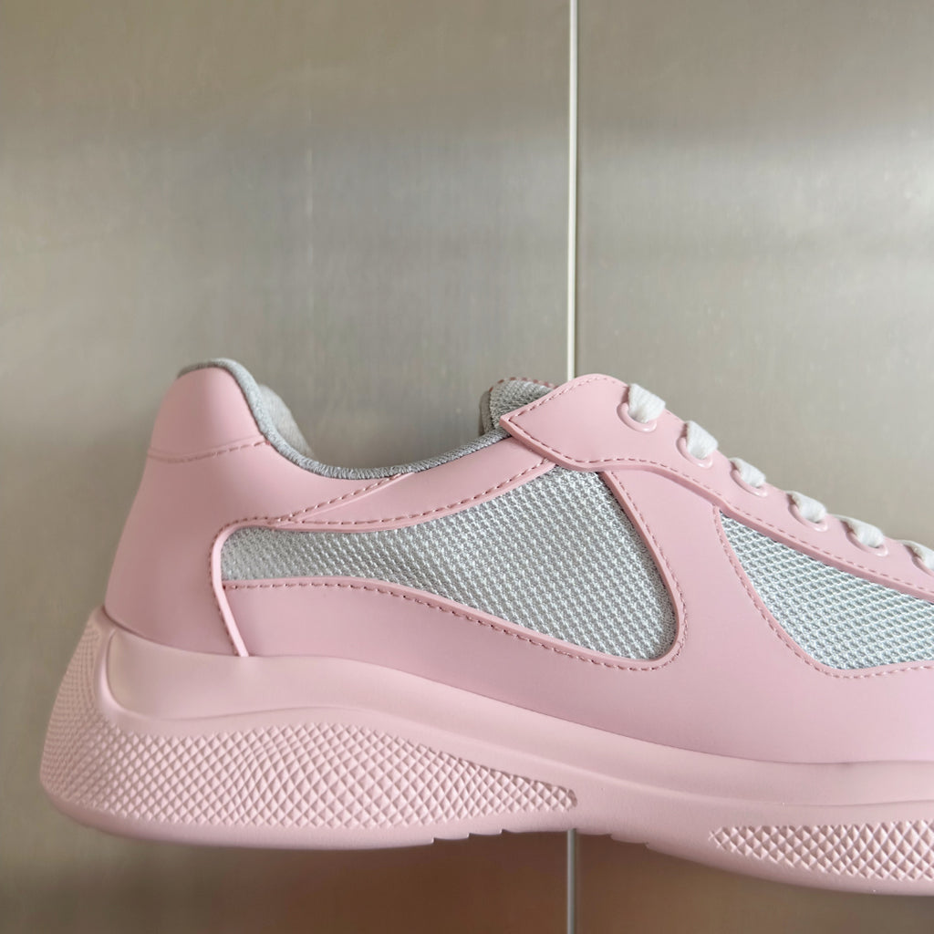 Pink Prada unisex sneaker with gray mesh side panel and textured rubber sole