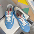 Prada unisex sneakers in light blue with white laces and gray-mesh accents