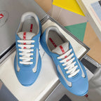 Prada unisex sneakers in light blue with white laces and gray-mesh accents
