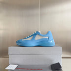 Prada unisex sneakers in light blue with white lace trim and breathable mesh inserts