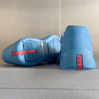 Prada unisex sneakers heel and sole view, light blue with PRADA label detail