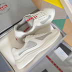White Prada unisex sneakers with gray mesh inserts and textured sole