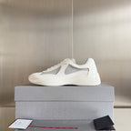 White Prada unisex sneakers with gray mesh toe and low profile sole