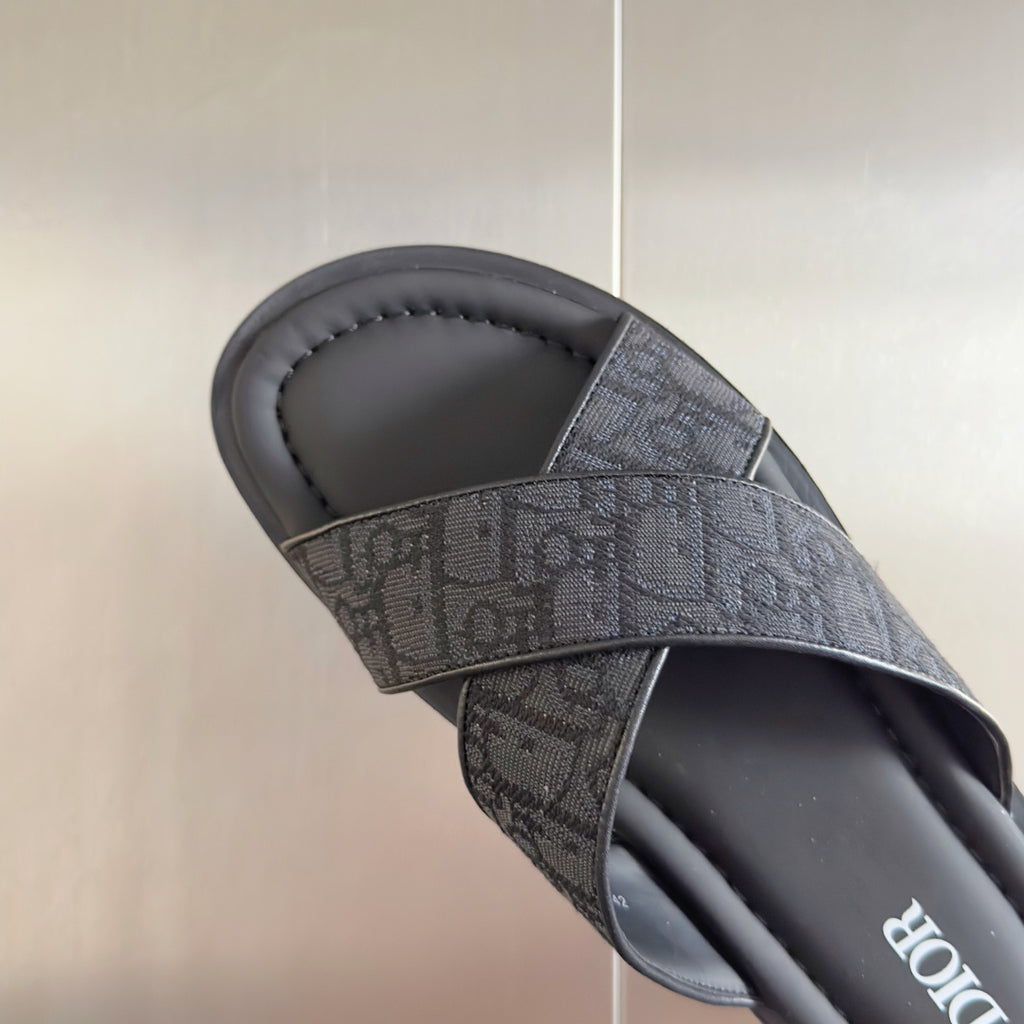 Dior slide sandal with gray monogram strap detail and cushioned black footbed