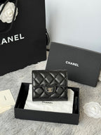 Small quilted leather flap bag, black, with CHANEL CC clasp and stitched quilting.