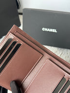 Small leather wallet-style bag, brown, close-up of card slots and inner compartments.
