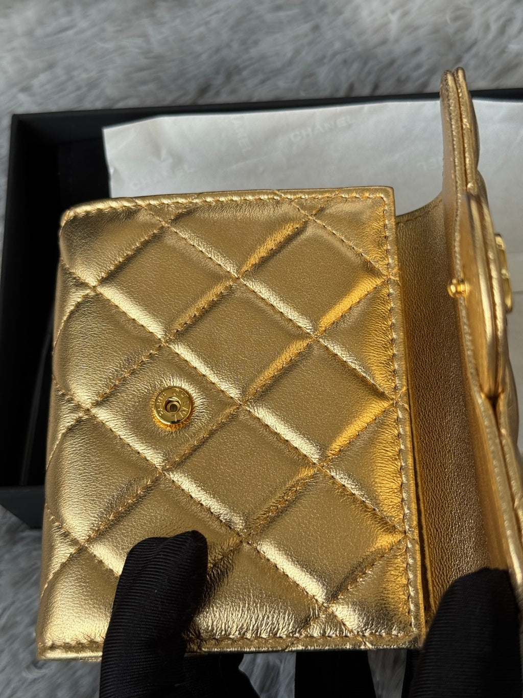 Chanel small gold quilted mini bag back view with diamond pattern and button detail