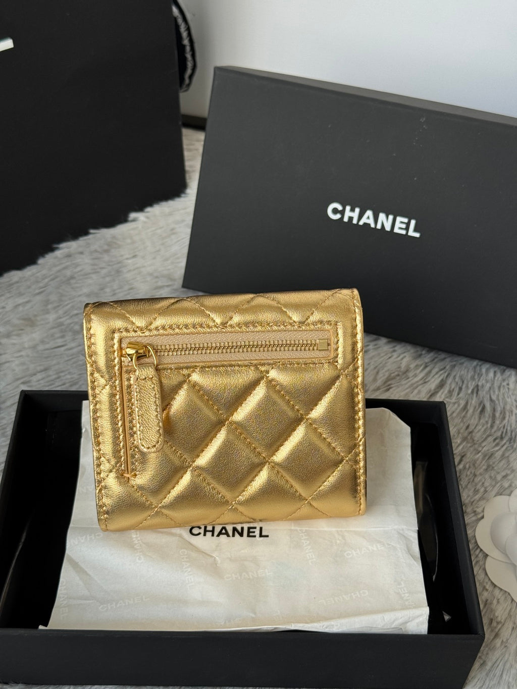Chanel small gold quilted mini flap bag with textured frame and front clasp, in box