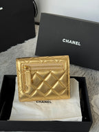 Chanel small gold quilted mini flap bag with textured frame and front clasp, in box