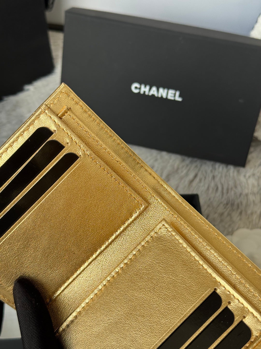 Chanel small gold mini bag interior card slots and stitching detail, close-up