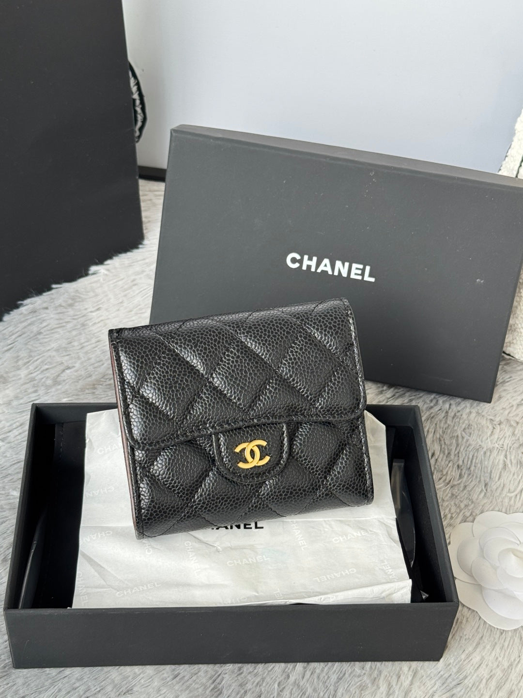 CHANEL small black quilted flap wallet, front view