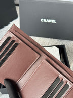Small bag interior view with card slots and CHANEL logo, pink leather