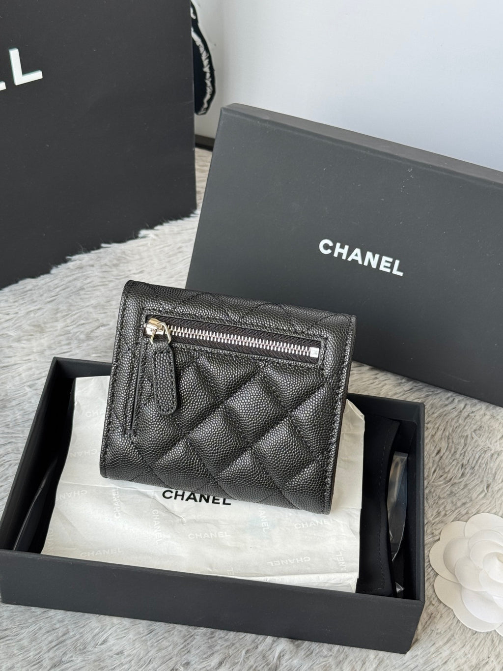 Black Chanel quilted leather small bag with zip pocket, front view