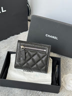 Black Chanel quilted leather small bag with zip pocket, front view