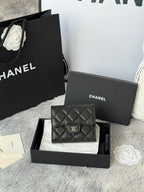Black Chanel quilted leather small bag with flap and CC clasp