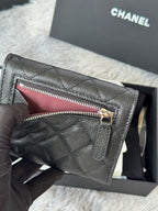 Black Chanel quilted leather small bag with top zipper and gold hardware