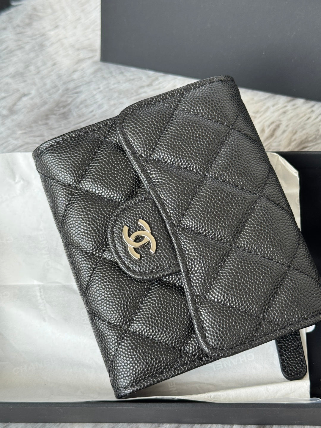 Black Chanel quilted leather small pouch bag with flap and gold emblem