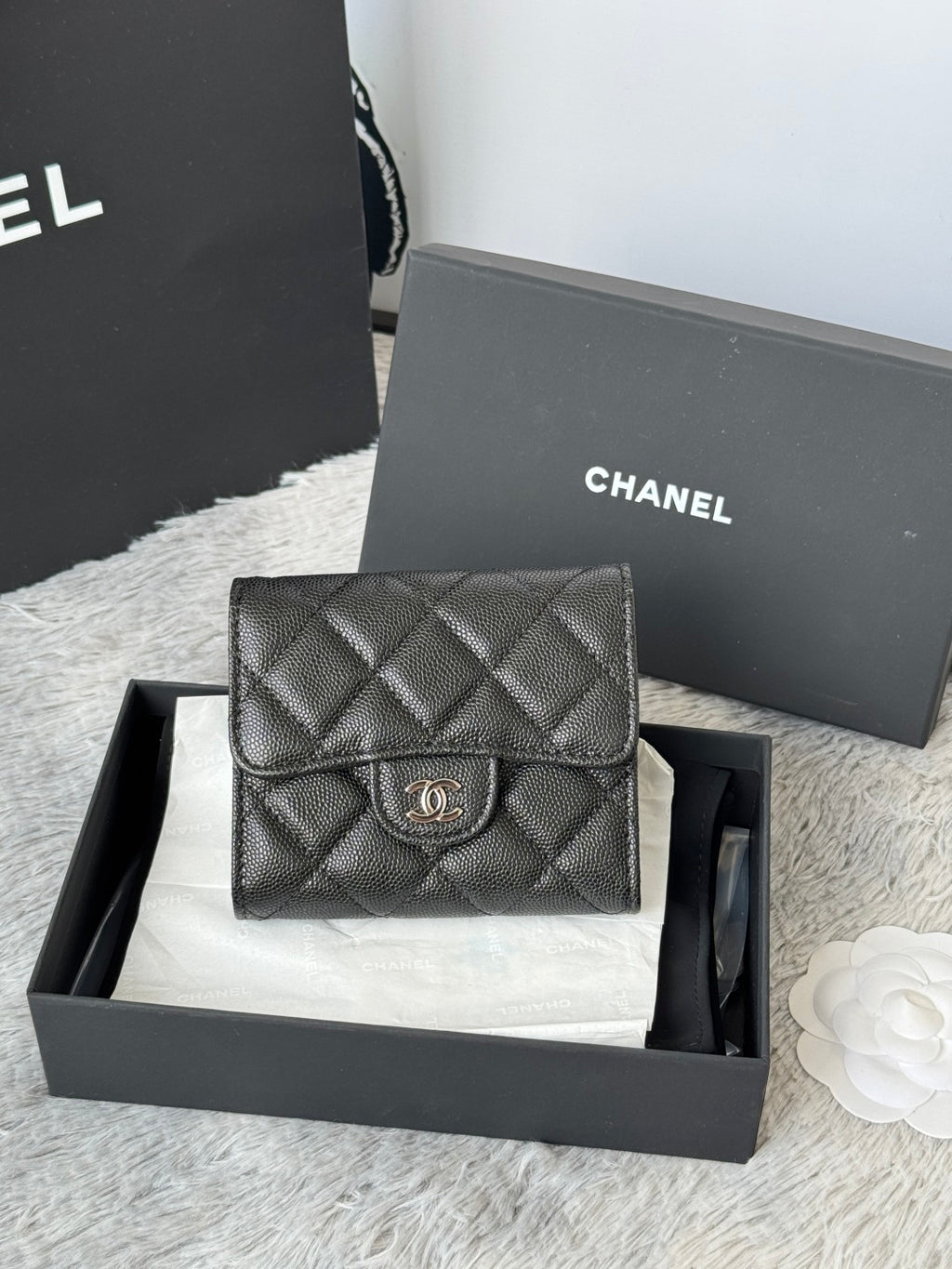 Black Chanel quilted leather flap bag with CC clasp, front view