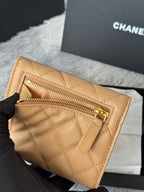 Small quilted flap bag, tan zip compartment with gold hardware and Chanel