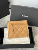 Small quilted flap bag, light tan back panel with Chanel logo on flap