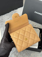 Small quilted flap card bag, tan leather with Chanel emblem and snap pocket