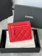 Red quilted small bag with front zip pocket and gold double-C logo