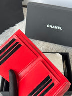 Red small bag with front card slots and black-trim handle