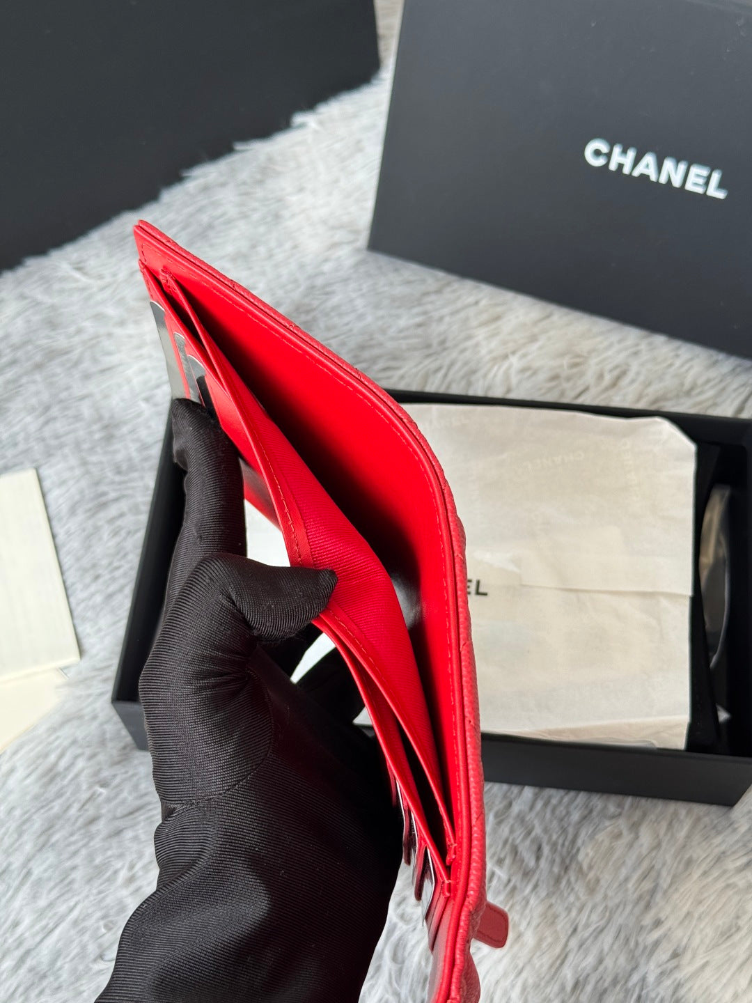 Red small bag open, showing interior and black card slot panel