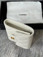 Off-white quilted mini bag open view showing compartments and stitching.