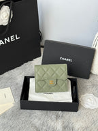 Small quilted leather flap bag in light green with CHANEL logo clasp