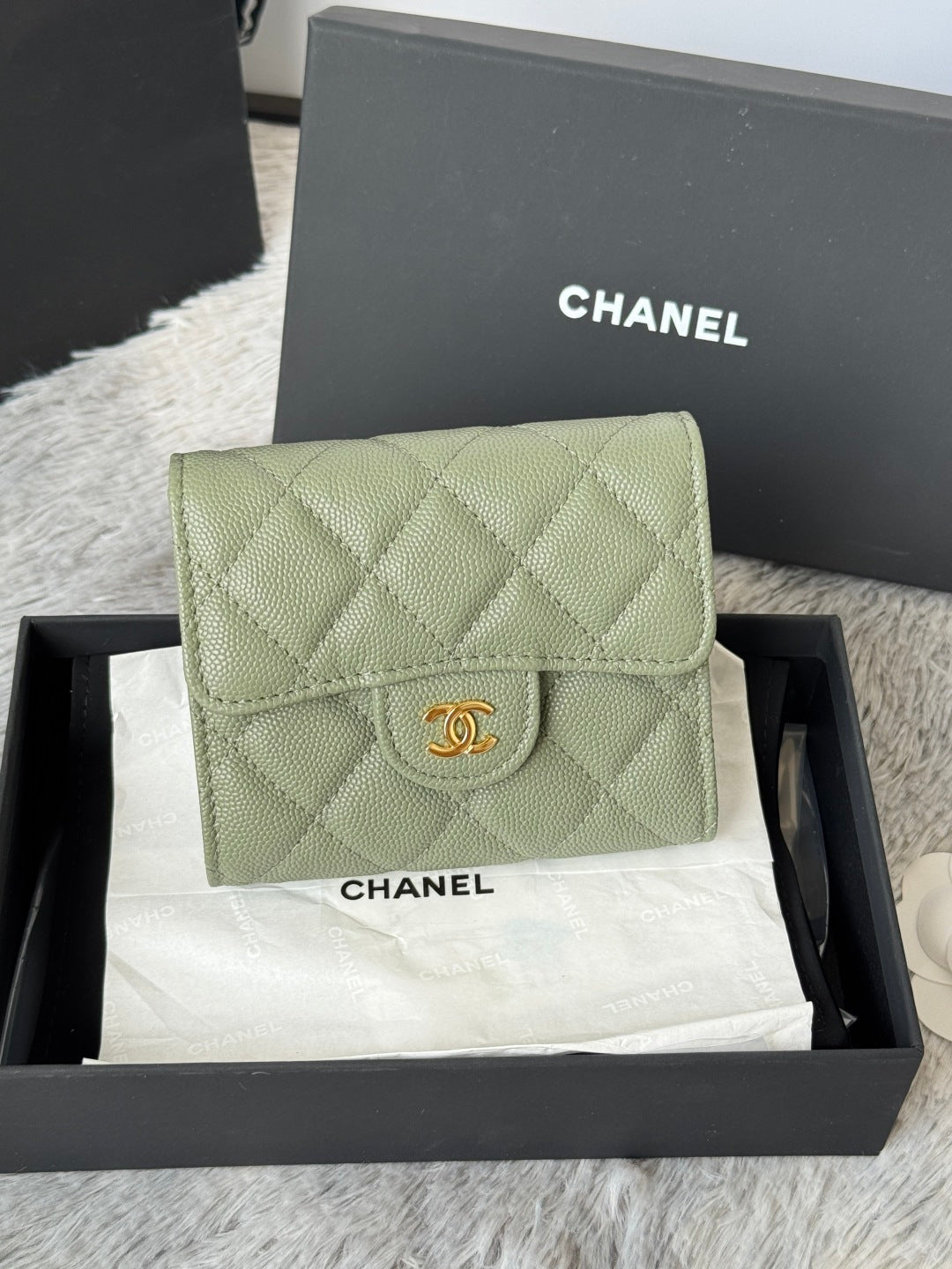 Small quilted light green flap bag with gold-tone CHANEL emblem