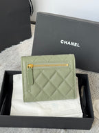 Small quilted leather bag in light green with gold zip and CHANEL logo