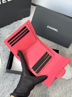 Pink quilted card holder wallet with cutout slots and gold CC detail, open view