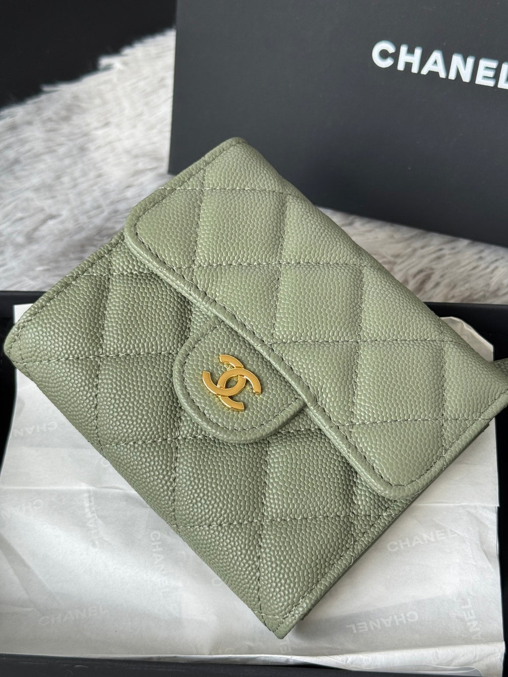 Small light green quilted leather flap bag with gold-tone CHANEL emblem