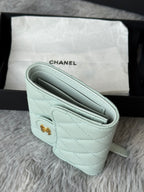 Mint quilted leather small bag interior view with slim slip pocket