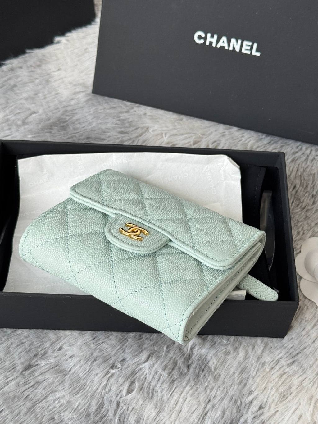 Mint quilted leather small bag with flap and wrist strap, side angle