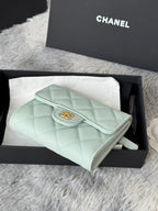 Mint quilted leather small bag with flap and wrist strap, side angle