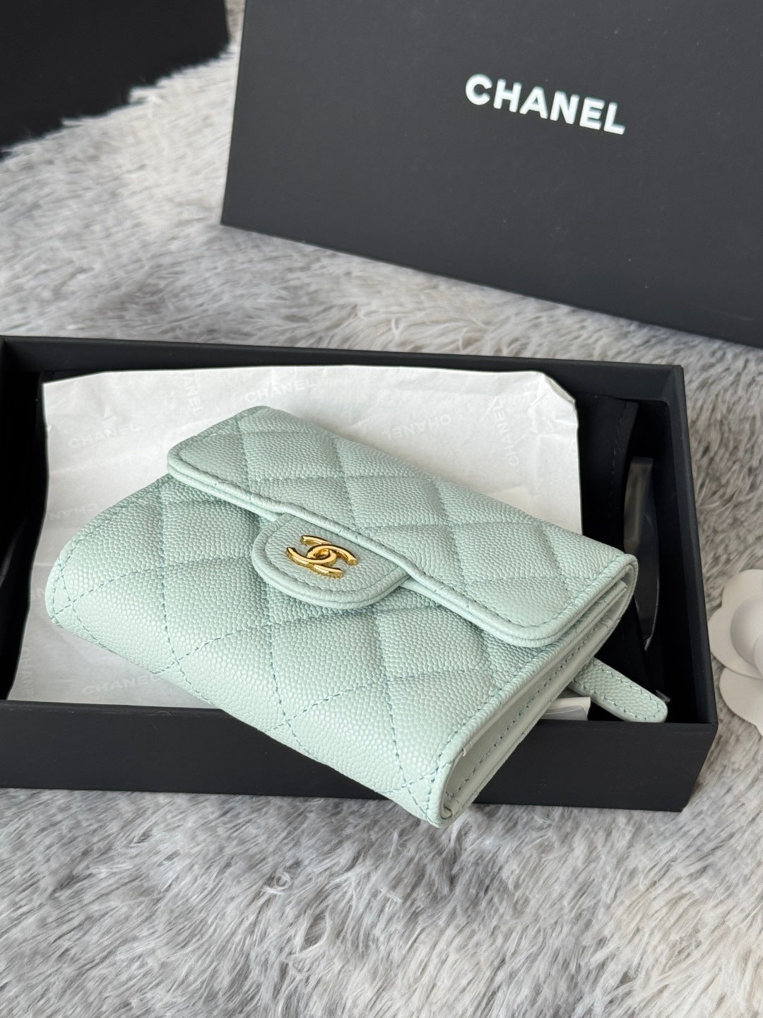 Mint quilted leather small bag with flap and wrist strap, side angle