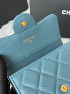 Small bag in light blue textured leather with CHANEL logo and quilted flap
