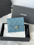 Small bag in light blue quilted leather with CHANEL logo on flap and gold-tone clasp