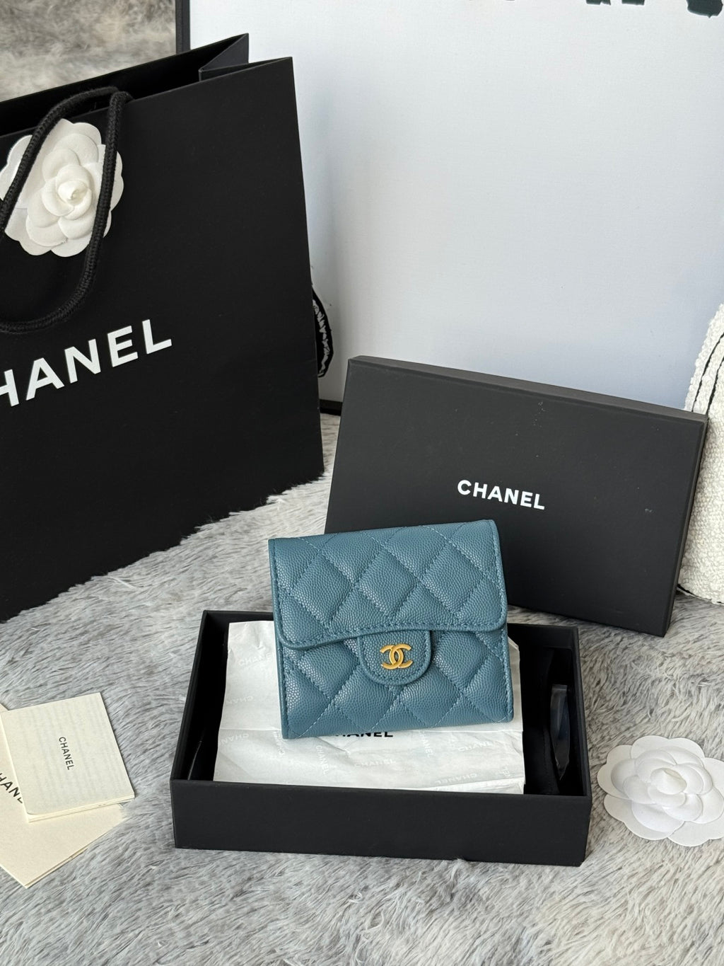 Small bag in light blue quilted leather with CHANEL logo clasp and flap front