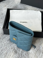 Small bag in light blue quilted leather with CHANEL logo and card slots