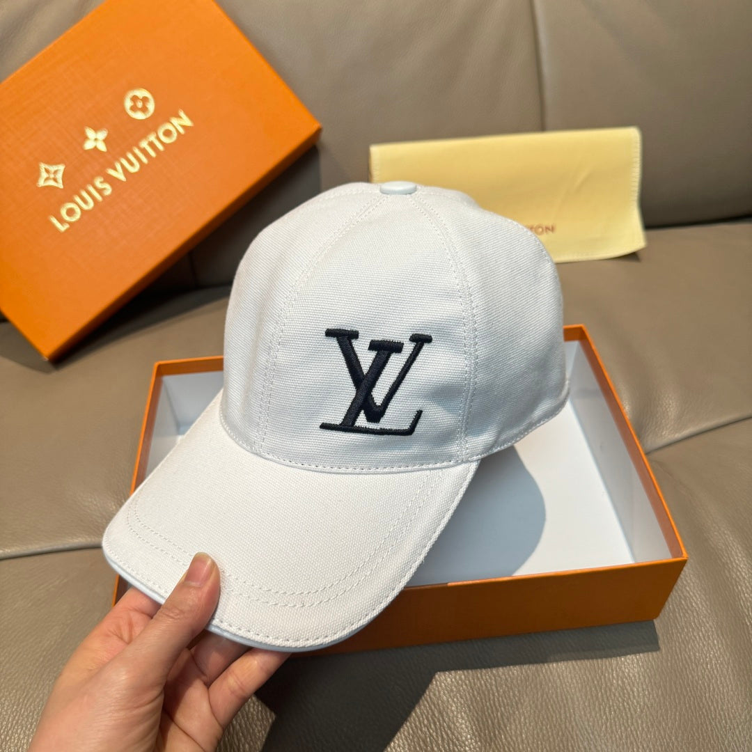 White Louis Vuitton cap front view with black LV logo and hand holding brim