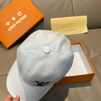 White Louis Vuitton cap back view with button top and partial LV logo