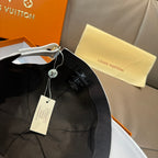 Black Louis Vuitton cap with adjustable strap and hanging tag
