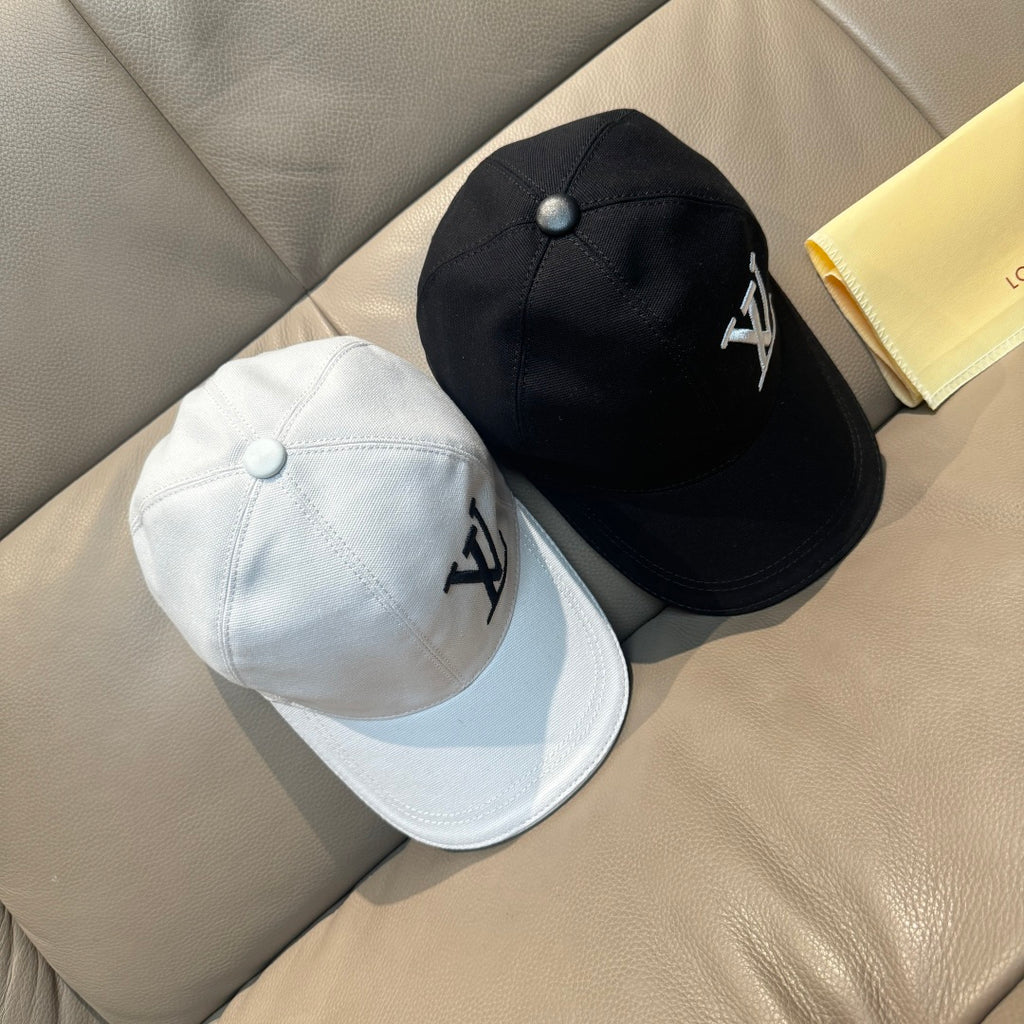 Louis Vuitton caps set: black and white baseball caps with LV monogram emblems.