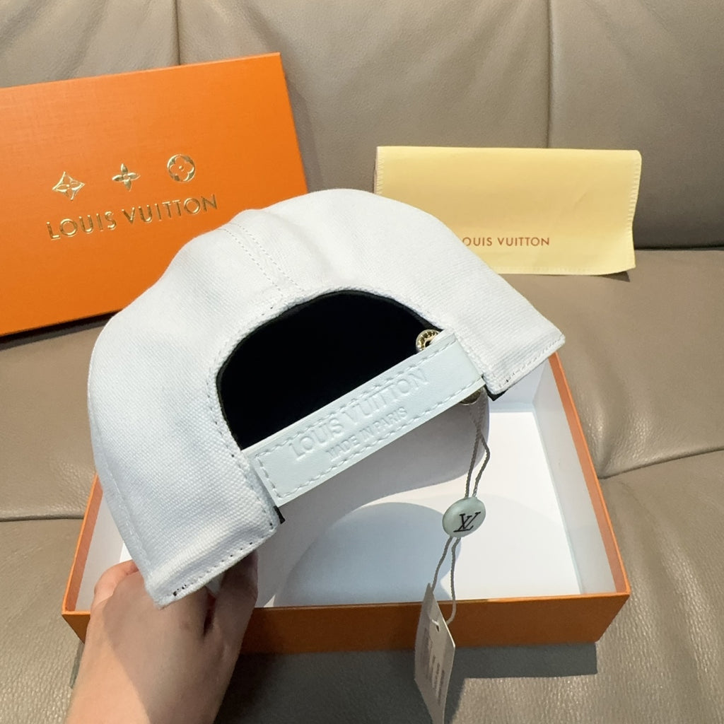 White Louis Vuitton cap with inner strap and Louis Vuitton label