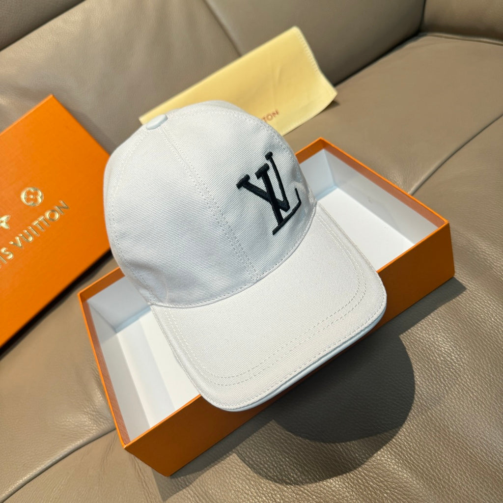 White Louis Vuitton baseball cap with black LV logo on front panel